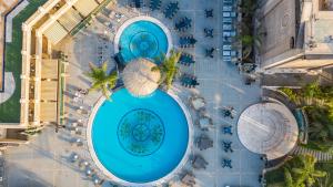 an overhead view of two large swimming pools at Al Masa Hotel Nasr City in Cairo