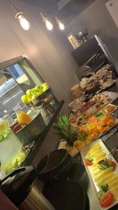 a kitchen with a bunch of fruits and vegetables at Centrum Hotel in Akureyri