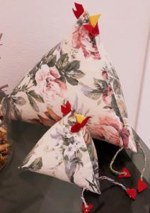 a pair of chicken cushions sitting on a table at Insula b&b in Cagliari