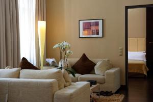 a living room filled with furniture and a couch at MyPlace - Premium Apartments City Centre in Vienna