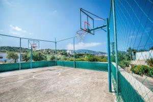 an empty basketball court with a hoop at Skopelos Holidays Hotel & Spa in Skopelos Town