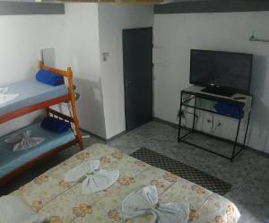 Una cama o camas en una habitación de Hospedaria Cambuci Unidade Ipiranga