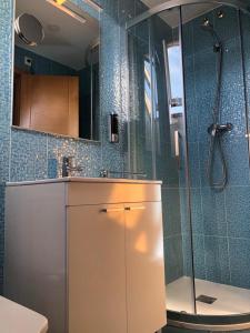 a bathroom with a shower and a sink and a toilet at El Rinconcito de Foz in Foz