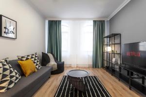 TV a/nebo společenská místnost v ubytování Martin Boutique Hotel