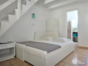 Ένα ή περισσότερα κρεβάτια σε δωμάτιο στο Gîte Cannelle