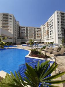 a large swimming pool in front of some buildings at Park Veredas Flat 312 - Rio Quente in Rio Quente