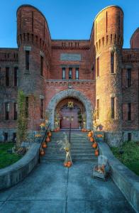 a large brick building with pumpkins in front of it at Amsterdam Castle NY in Amsterdam