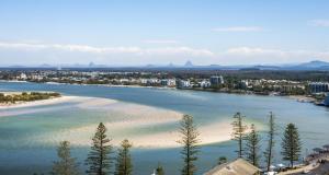 a view of a river with a beach and a city at Centrepoint Apartments Caloundra in Caloundra