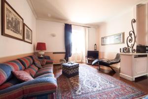 a living room with a couch and a table at La Gare in Magenta