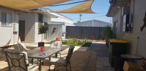 a patio with a table and chairs on a patio at Kadina Village Motel in Kadina