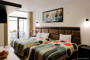Кровать или кровати в номере Hotel Turin