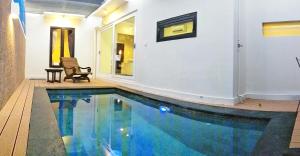 a swimming pool in the middle of a house at Maya Kori Villa in Jimbaran