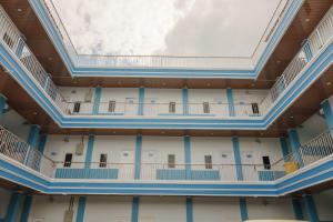 an interior view of a building with a skylight at RedDoorz Plus near Palembang Icon Mall 2 in Palembang