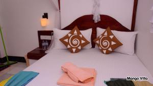 Letto o letti in una camera di Mango Villa Sigiriya