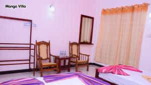Letto o letti in una camera di Mango Villa Sigiriya