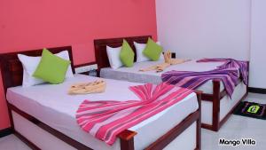 Letto o letti in una camera di Mango Villa Sigiriya