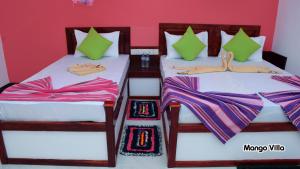 Letto o letti in una camera di Mango Villa Sigiriya