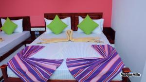 Letto o letti in una camera di Mango Villa Sigiriya