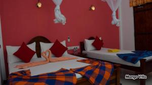 Letto o letti in una camera di Mango Villa Sigiriya