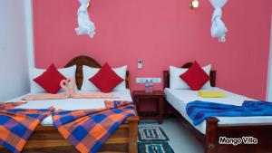 Letto o letti in una camera di Mango Villa Sigiriya