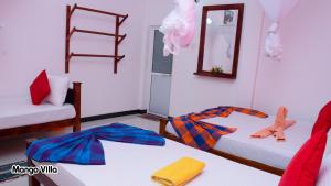 Letto o letti in una camera di Mango Villa Sigiriya