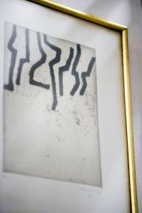 a framed painting of a spiderweb at Hotel Niza in Donostia-San Sebastián