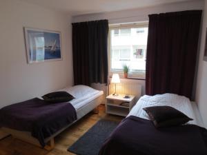Säng eller sängar i ett rum på Hotel Göingehof