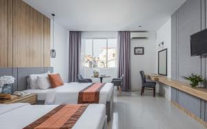 Postel nebo postele na pokoji v ubytování Altos Hotel