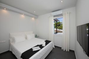 Postel nebo postele na pokoji v ubytování Zannis Hotel + 37 fotografií