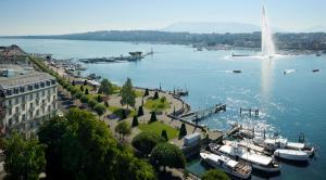 a large body of water with a lighthouse at Beau-Rivage Genève in Geneva