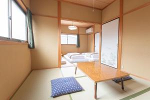 Letto o letti in una camera di Yachiyo - モトオコノミヤキヤ - BBQ OK & Pet Friendly - Self Check-In Only