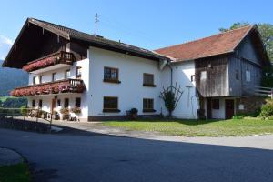 a white house with a brown roof at Teisenbergblick in Gschwend