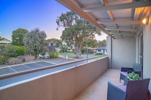 a balcony with chairs and a view of a yard at Villa on Fearn in Margaret River Town