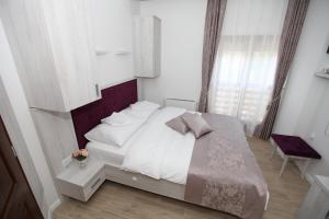 Voodi või voodid majutusasutuse Apis Hotel toas