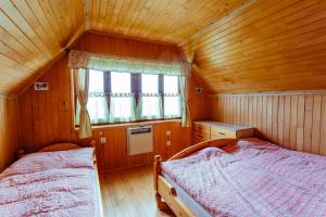 Posteľ alebo postele v izbe v ubytovaní Chata Alpina
