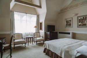 Postel nebo postele na pokoji v ubytování Art Hotel