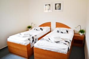 Postel nebo postele na pokoji v ubytování Hotel S-centrum