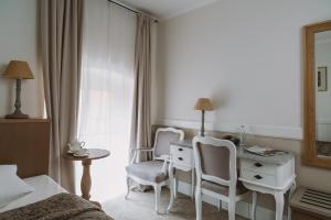 Postel nebo postele na pokoji v ubytování Art Hotel