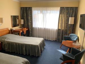 Postel nebo postele na pokoji v ubytování Hotel Druzhba
