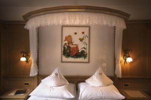 Postel nebo postele na pokoji v ubytování Hotel Garni Concordia - Dolomites Home