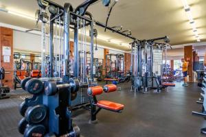 a gym with a bunch of machines in it at Apartamentos los volcanes in Puerto del Carmen