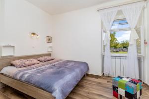 Postel nebo postele na pokoji v ubytování Holiday house TRSJA