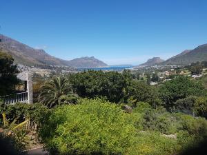 a view of a city from a hill with mountains at Victorskloof Lodge in Hout Bay
