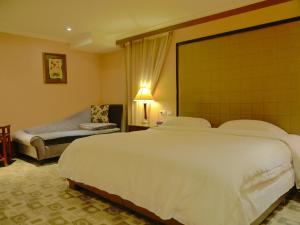 Letto o letti in una camera di Kai Wei Boutique Hotel