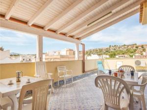 a terrace with tables and chairs on a roof at camera azzurra San Vito Lo Capo in San Vito lo Capo