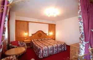 Postel nebo postele na pokoji v ubytování Family & Wellness Hotel Fontana