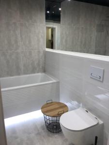 Łazienka w obiekcie Apartament 100 Apartamenty No 1 Ogród w Centrum