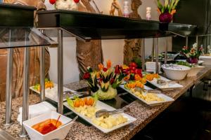 a buffet with several plates of food on a table at Lara Park Hotel in Antalya