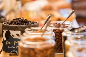 a table topped with jars of coffee beans at Hotel la Rotonde in Verbier