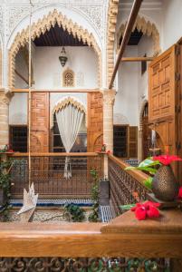 an entry to a building with a gate and a balcony at Riad Marhaba in Rabat